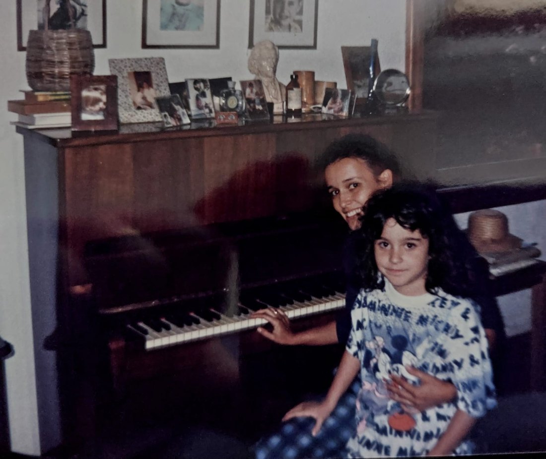 Amy as a kid at the piano