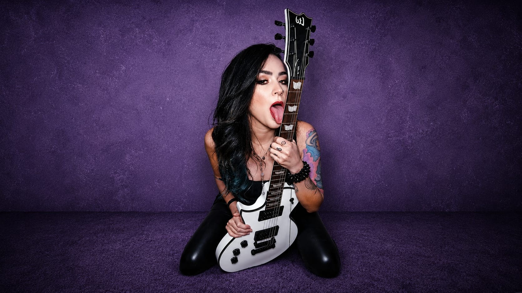 Amy Stargher with her white guitar